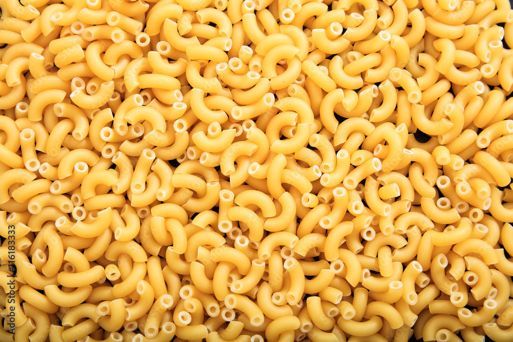 Full background of raw macaroni pasta Full background of raw macaroni pasta