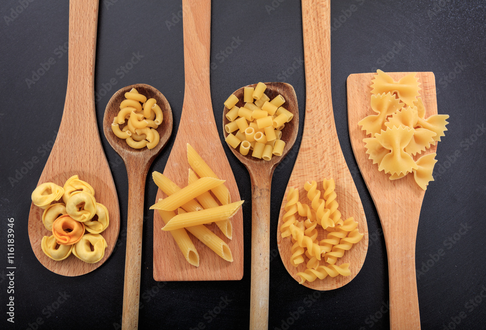 Various shapes of pasta on a black background Various shapes of pasta on a black background
