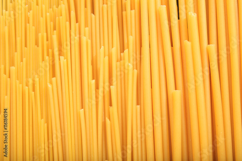 Full background of raw spaghetti pasta