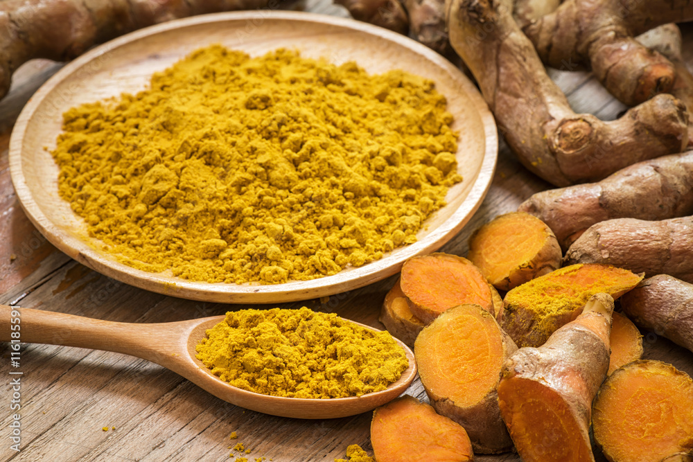 fresh turmeric roots with turmeric powder fresh turmeric roots with turmeric powder