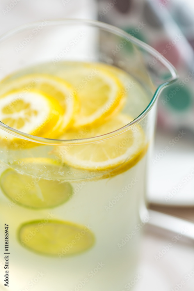 Jug of lemonade served on the dinner table Jug of lemonade served on the dinner table