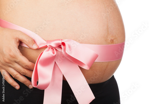 Wallpaper Mural Pregnant woman with pink ribbon around her belly Torontodigital.ca
