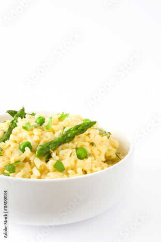 Risotto with asparagus and peas isolated on white background

