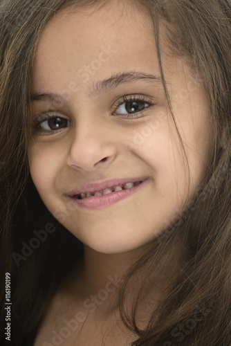 Closeup Portrait of Attractive Young Girl With Beautiful Smile