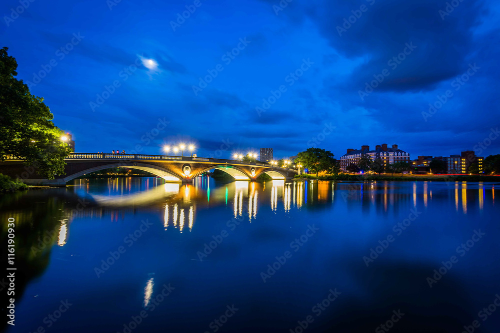 The moon over the John W Weeks Bridge and Charles River at night