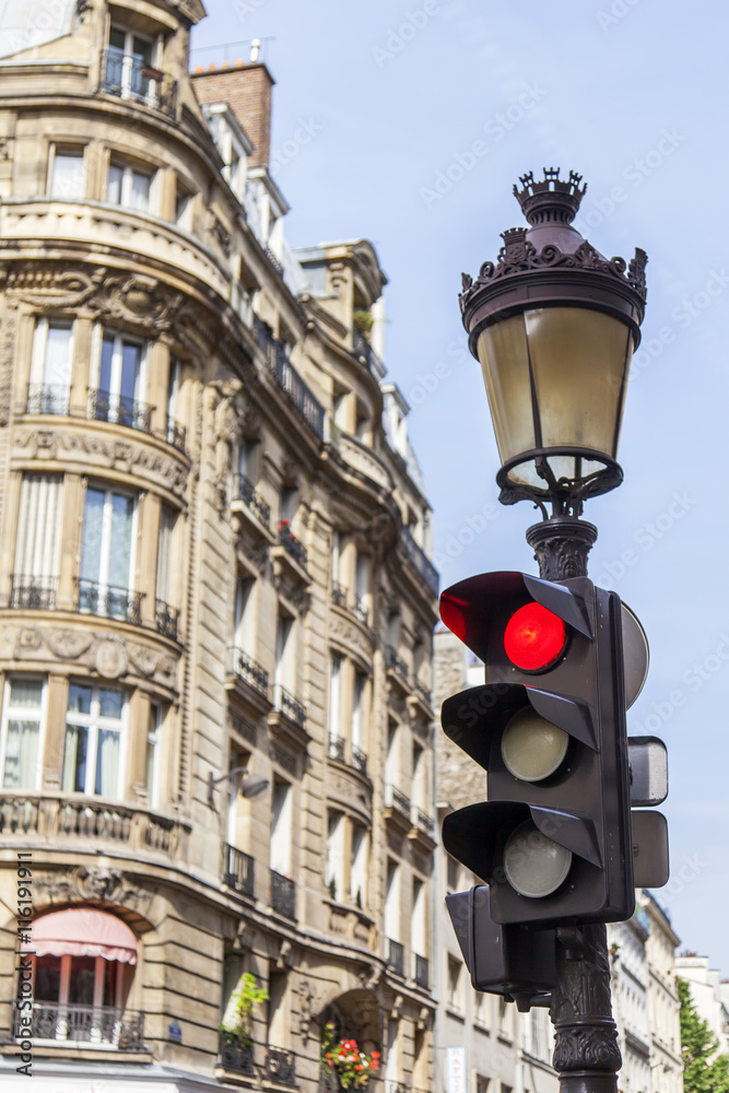 Obraz premium PARIS, FRANCE, on JULY 12, 2016. Typical urban view. Elements of transport navigation. The traffic light at the intersection