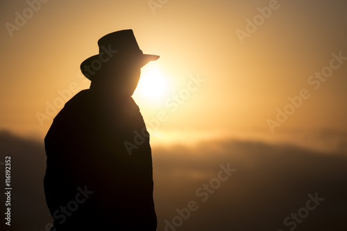 Fototapet Ranger Silhouette on orange Background