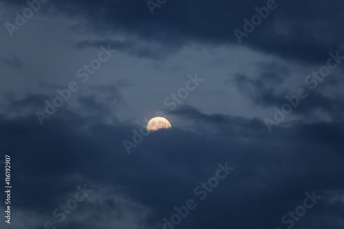 Full moon with dark cloud