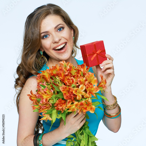 Beautiful girl holding flawors bouquet with gift box. Isolated photo