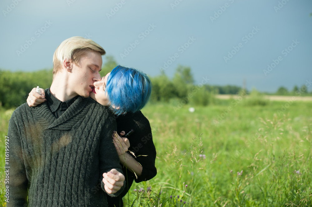 man and woman with dyed hair romantically spend time in nature. romantic couple in love outdoors man and woman with dyed hair romantically spend time in nature. romantic couple in love outdoors