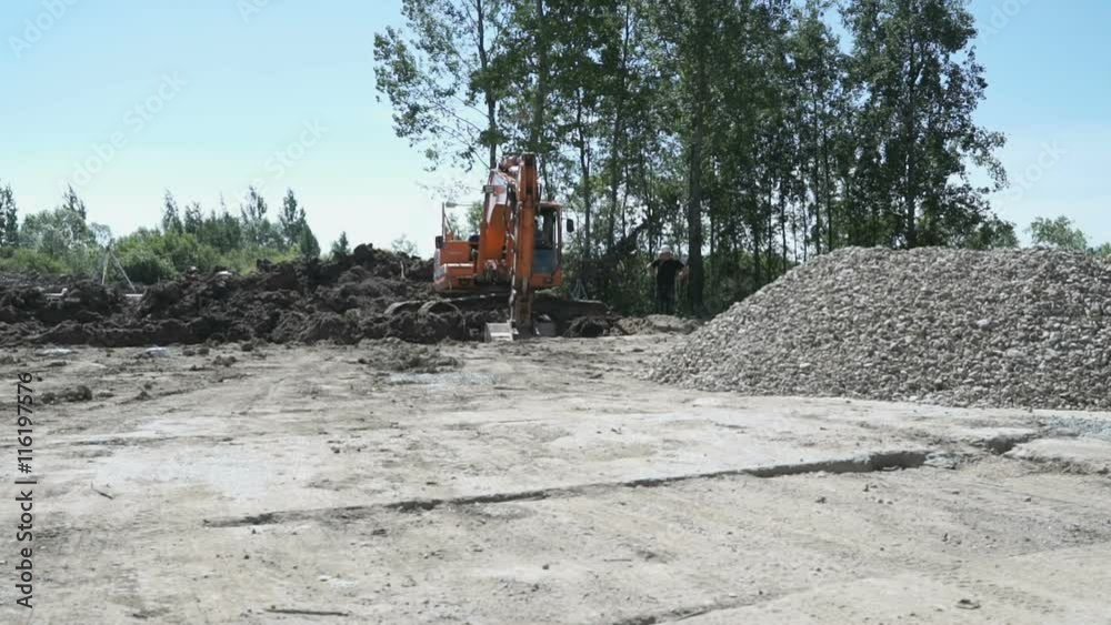 Excavator working on construction site Excavator working on construction site