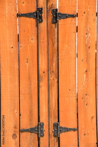 knotted wooden picket fence and gate and hinges