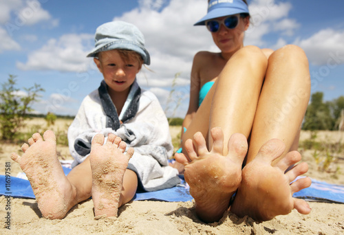 Mother and daughter having fun on beach
