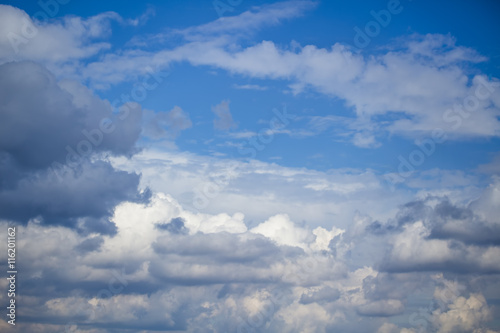 Fototapeta Naklejka Na Ścianę i Meble -  Sky clouds, blue fluffy storm clouds. Background of blue sky with white cumulus clouds.