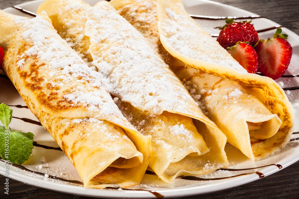 Crepes with strawberries and cream Crepes with strawberries and cream