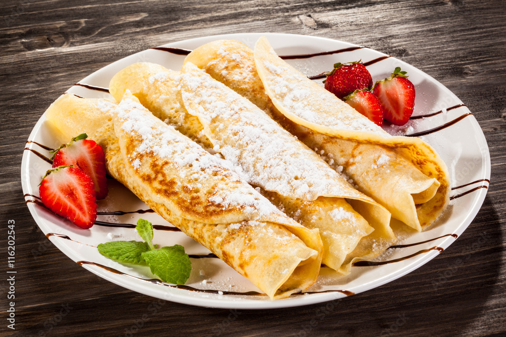 Crepes with strawberries and cream Crepes with strawberries and cream