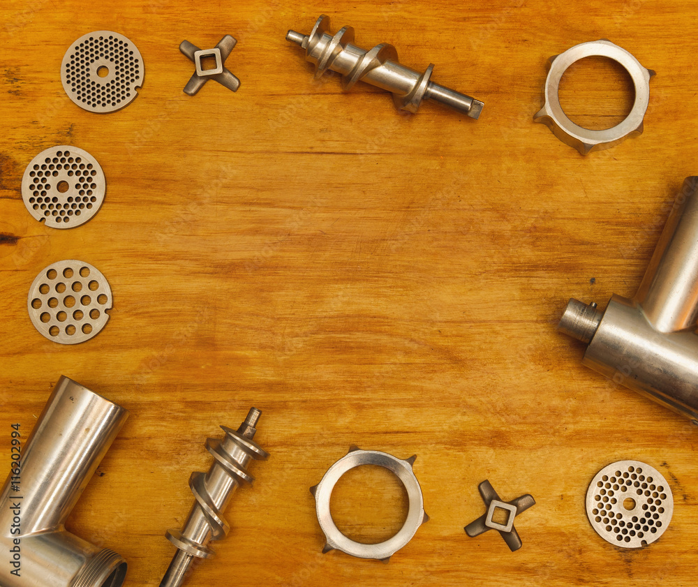 meat grinder part lying on table meat grinder part lying on table