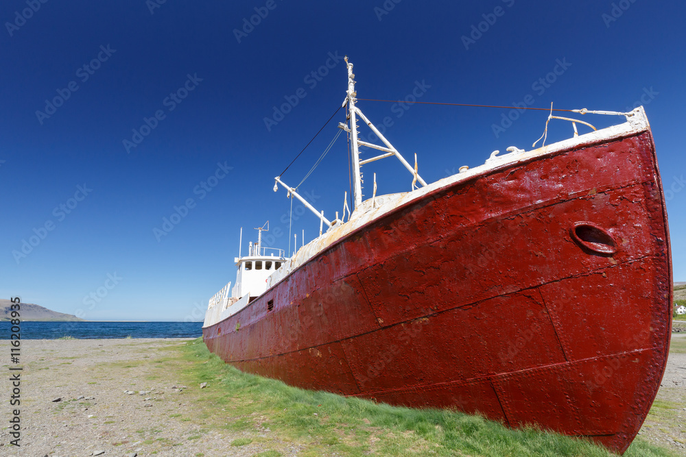 Old boat on a beach in Patrekfjordur, Westfjords, Iceland
