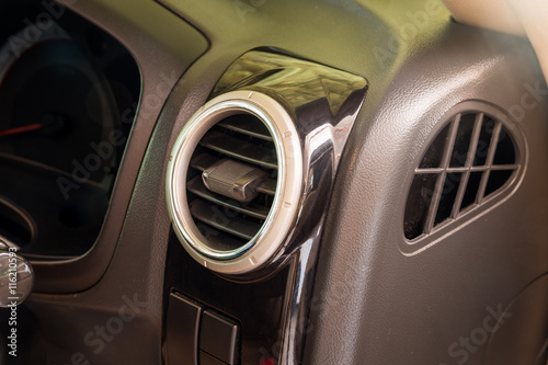 Modern car air conditioning system grid panel on console © powerbeephoto