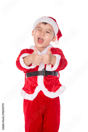 Portrait of a boy in red christmas hat doing the okay gesture