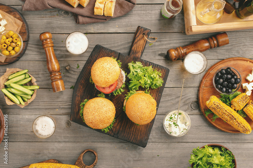 Different burgers with beer