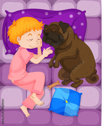 Little boy sleeping with pet dog in bed