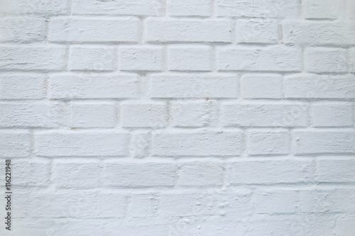 wall of building of bricks painted in white lime solution