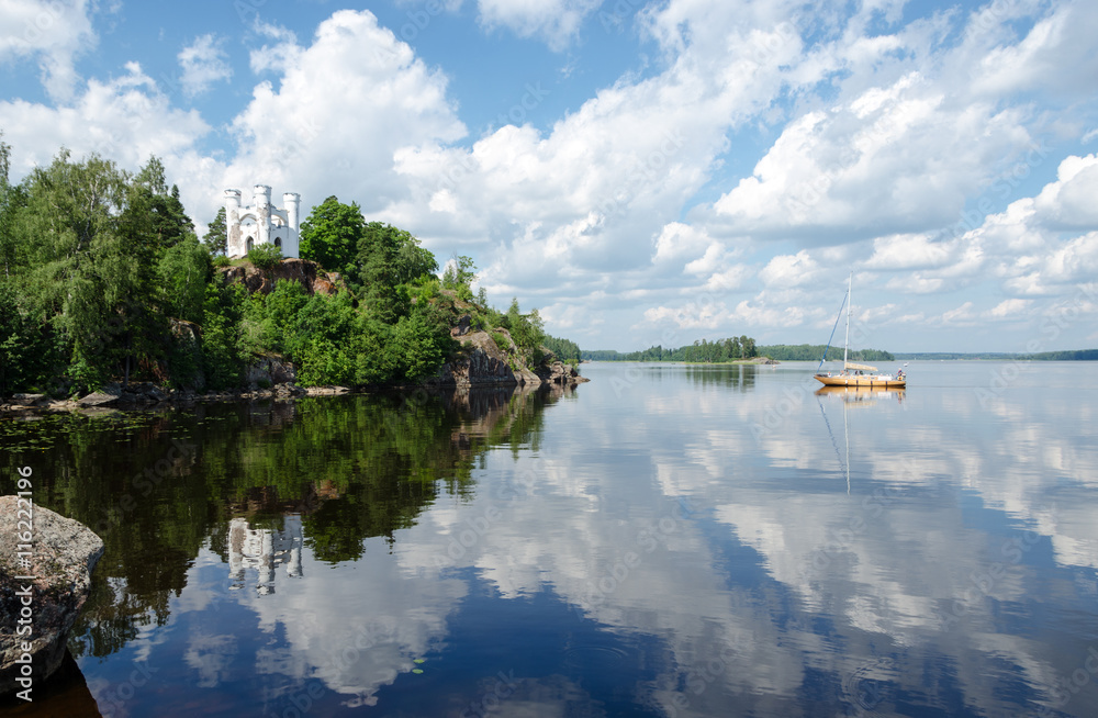 Fototapeta premium Landscape with a chapel over lake