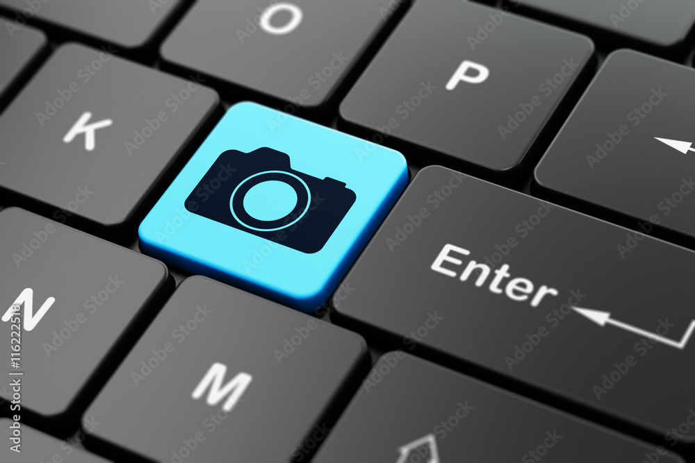 Travel concept: Photo Camera on computer keyboard background Travel concept: Photo Camera on computer keyboard background