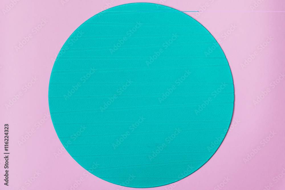 Blue round stand on pink background. Minimal concept. Flat lay, top view.