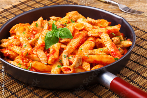 Penne with roasted chicken in tomato sauce