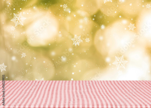 Empty red tablecloth material wooden, deck for Christmas background.