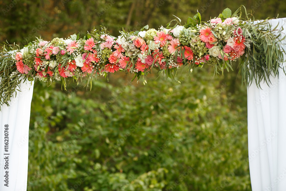 Fototapeta premium The wedding archway with flowers