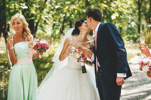 The brides kissing in the park photo