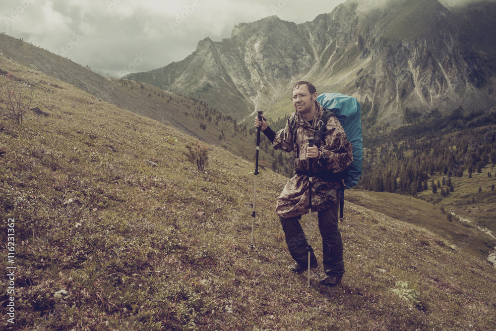 man climbs a mountain at the beautiful view man climbs a mountain at the beautiful view