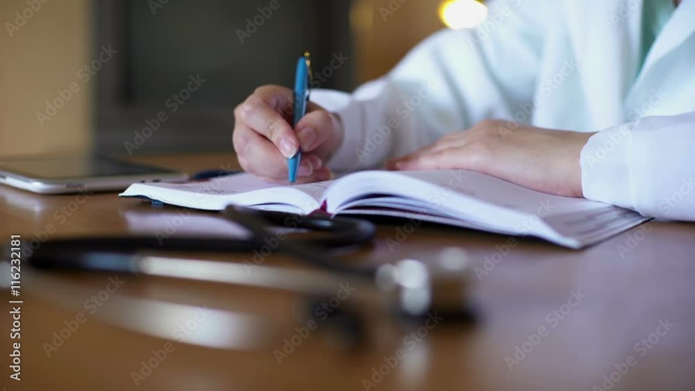 Medical workers holding a meeting to discuss some organizational issues Medical workers holding a meeting to discuss some organizational issues