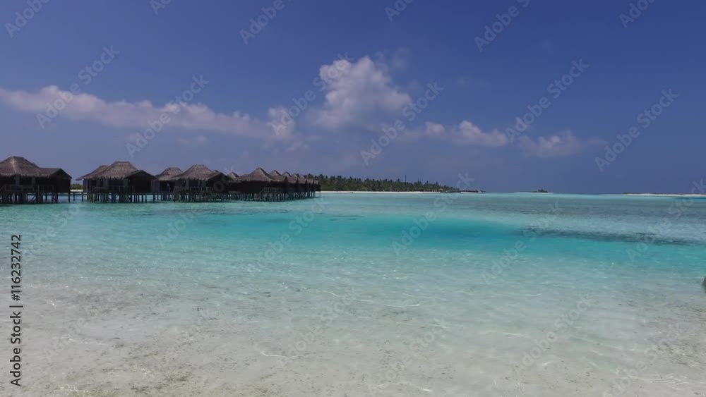 bungalow huts in sea on tropical resort beach bungalow huts in sea on tropical resort beach