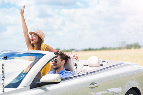 Couple enjoying a drive in a convertible
