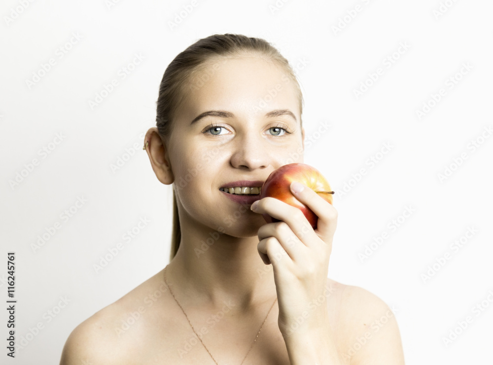 beautiful naked young woman eating an apple. healthy food - strong teeth concept beautiful naked young woman eating an apple. healthy food - strong teeth concept