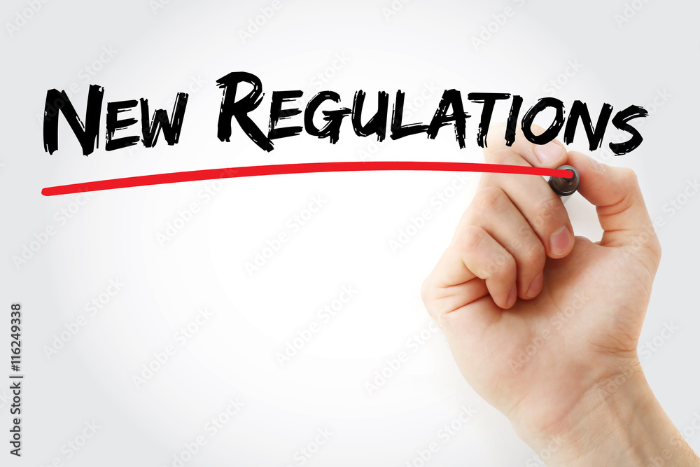 Hand writing New Regulations with marker, concept background Hand writing New Regulations with marker, concept background