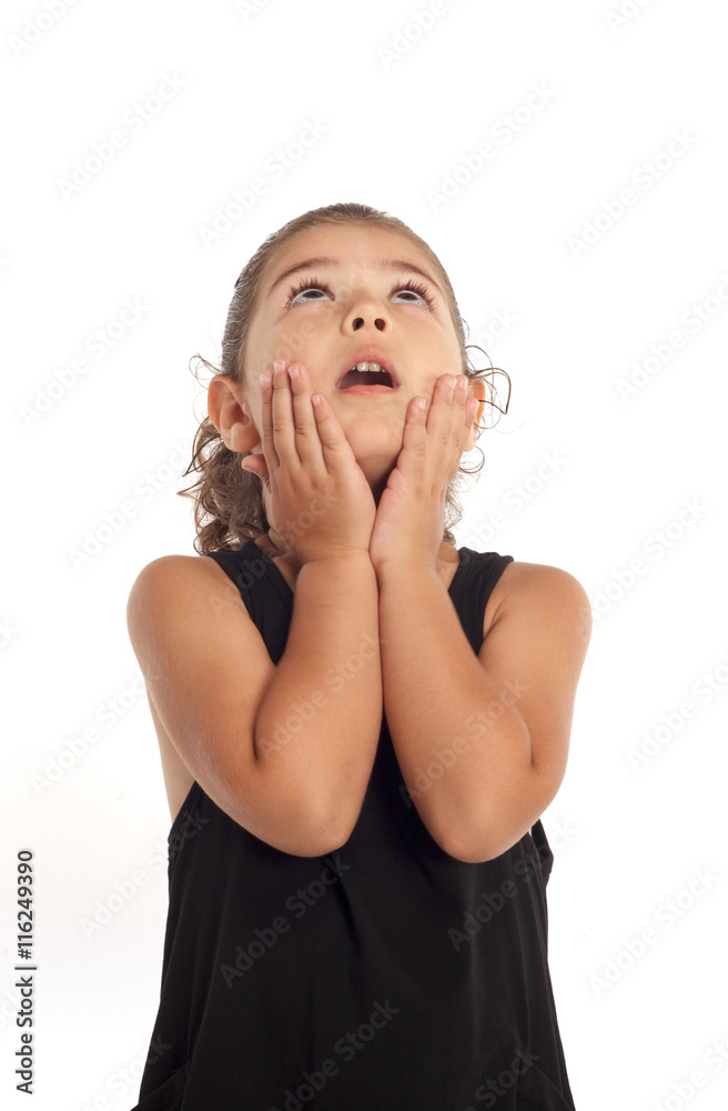 Portrait of a happy little girl looking up on white background Portrait of a happy little girl looking up on white background