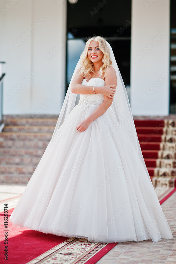 Elegant blonde blue eyes fashion bride at great wedding hall on