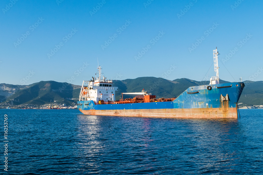 Cargo ship anchored in the roadstead Tsemes bay at the entrance of the port of Novorossiysk, Russia