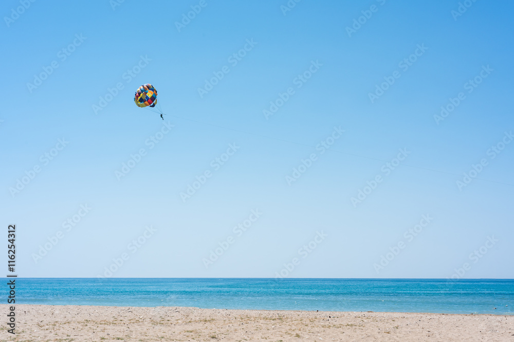 Parasailing summer sport. Parachute and boat. High in the sky over the sea. Parasailing summer sport. Parachute and boat. High in the sky over the sea.