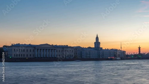 Building of Kunstkamera and the cityscape night to day timelapse viewed from the Admirality embankment. photo