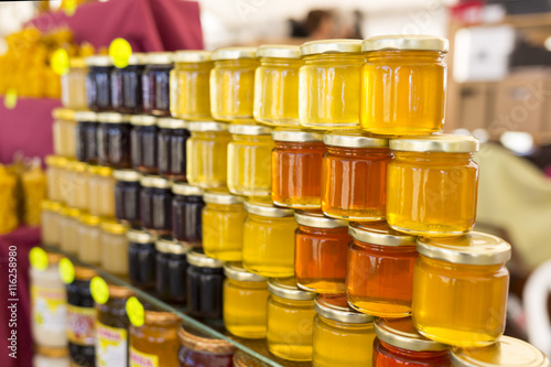 Different jars of honey photo