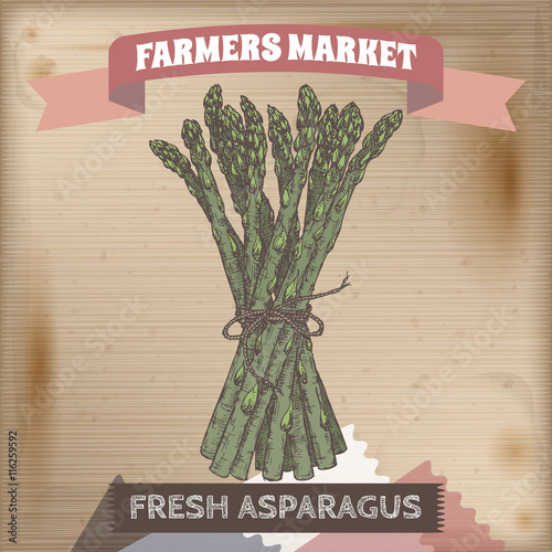 Famer market label with asparagus color sketch on wooden background.