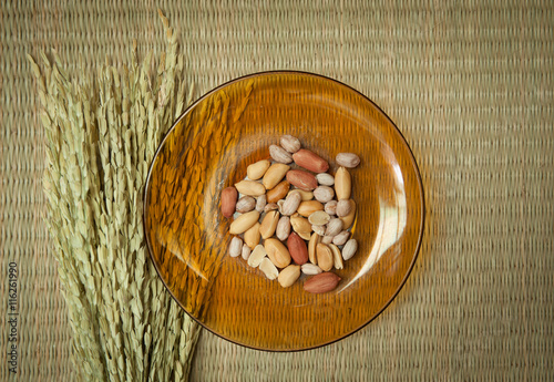 Top view of Peanut in  plate on the bamboo mats background
