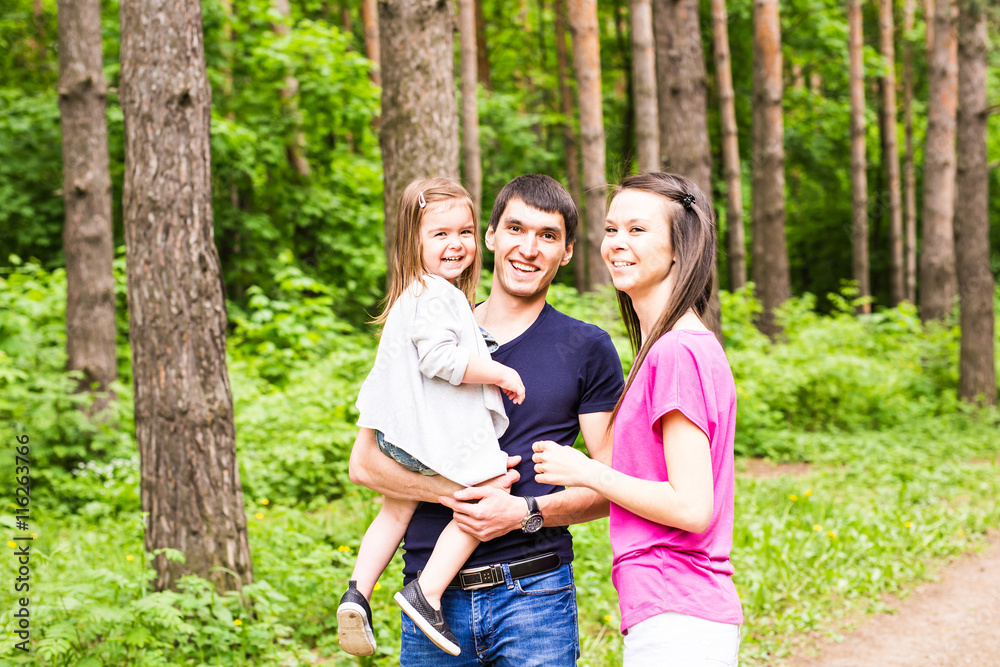 Happy family having fun outdoors and smiling Happy family having fun outdoors and smiling