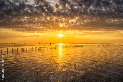 Sunrise time Thai fisherman village in Bangtaboon Petchaburi, Th
